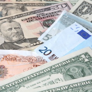 Money. World currencies: U.S. dollars, pounds and euros.